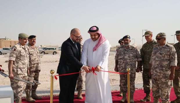 Deputy Prime Minister and Minister of State for Defence Affairs Dr Khalid bin Mohamed al-  Attiyah and Chargu00e9 du2019Affaires of the US Embassy to Qatar Ryan M Gliha cut a ribbon to mark   the groundbreaking ceremony for the expansion of Al Udeid Air Base.