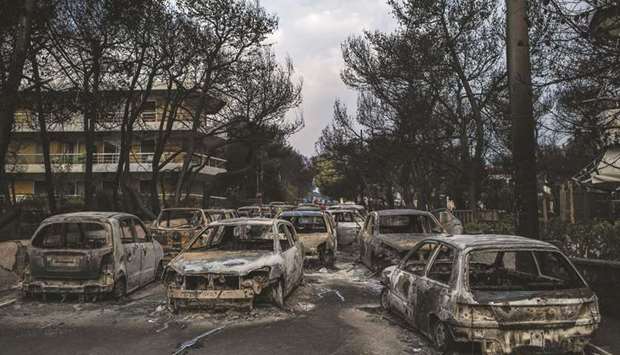 This photo taken yesterday shows the aftermath of a wildfire that swept into the village of Mati, near Athens.
