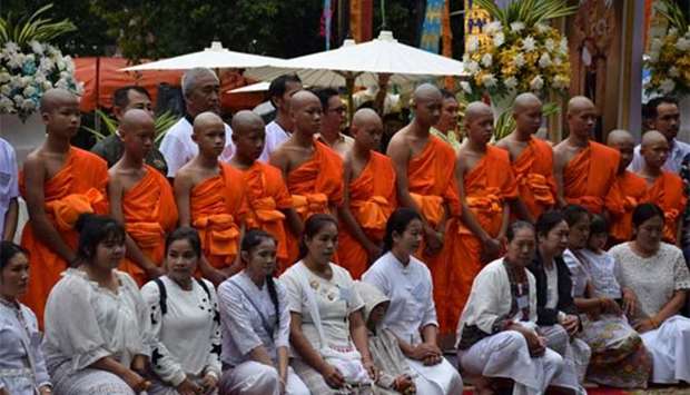 Members of the soccer team rescued from a Thai cave attend a Buddhist ordination ceremony at a temple at Mae Sai, Chiang Rai, on Wednesday.