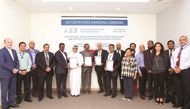 Officials and participants attend the ceremony to handover the ISO certifications to AEB.