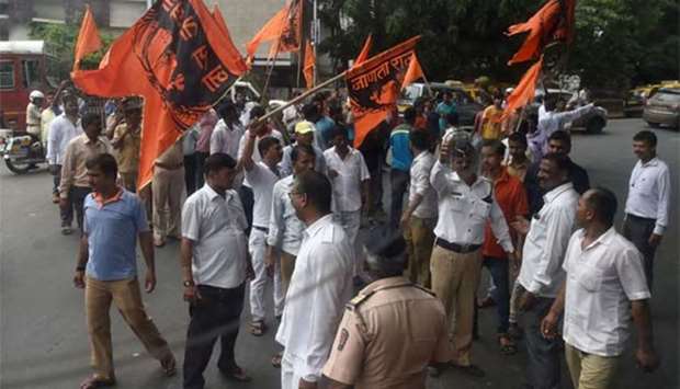 Members of the Maratha community in the Indian state of Maharashtra try to block traffic during a protest in Mumbai on Wednesday.