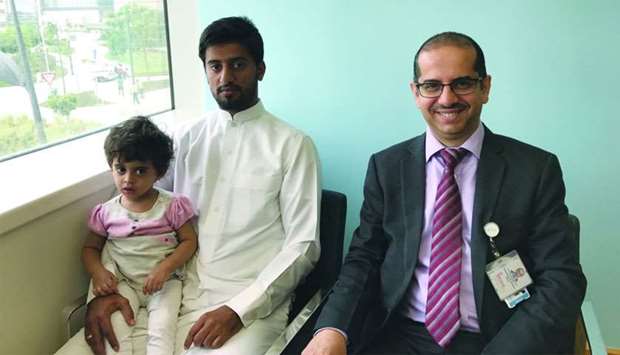 Baby Mona with her father and Dr al-Kharazi.