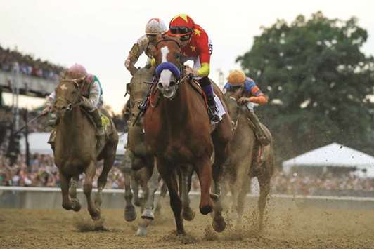 Justify with jockey Mike Smith aboard wins the 150th running of the Belmont Stakes, the third leg of the Triple Crown of Thoroughbred Racing at Belmont Park in Elmont, New York on June 9, 2018. (Reuters)