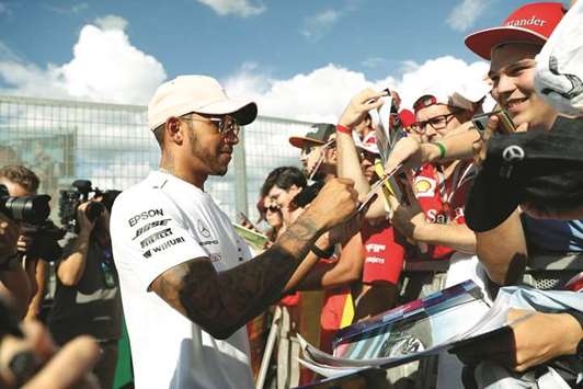 Mercedesu2019 Lewis Hamilton signs autograph for fans ahead of the Hungarian Grand Prix. (Reuters)