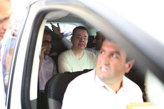 This picture taken on Wednesday shows Brunson in a car while being escorted from the prison in Izmir, Turkey.