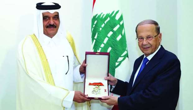 Lebanese President Michel Aoun presents ambassador Ali bin Hamad al-Marri with the National Decoration of the Cedar, Grade of Great Officer