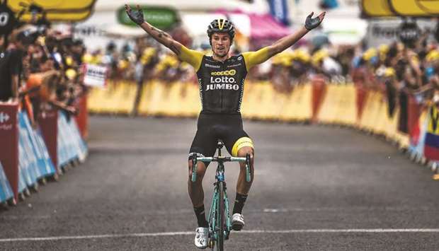 Sloveniau2019s Primoz Roglic celebrates after winning the 19th stage of the Tour de France cycling race between Lourdes and Laruns in southwestern France yesterday. (AFP)