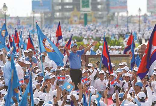 Cambodian Peopleu2019s Party (CPP) president and Prime Minister Hun Sen waves to his supporters during campaign on final day in Phnom Penh yesterday.