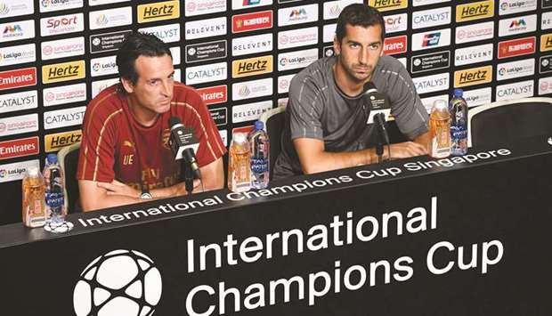 Arsenalu2019s manager Unai Emery (left) and midfielder Henrikh Mkhitaryan attend a press conference ahead of their pre-season International Champions Cup match against Paris St-Germain in Singapore yesterday. (AFP)