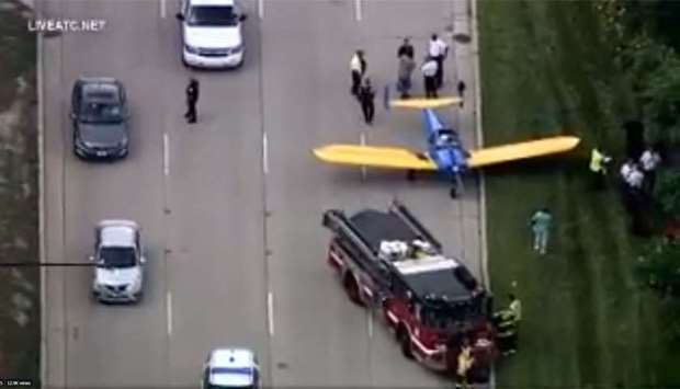 A screenshot from a video posted on Twitter that shows the small plane landed on  Lake Shore Drive roadway