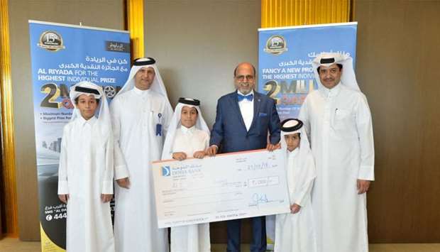 Doha Bank CEO Dr R Seetharaman during the awarding of the ceremonial cheque to the bank's latest winner of the Al Dana Young Saver scheme.