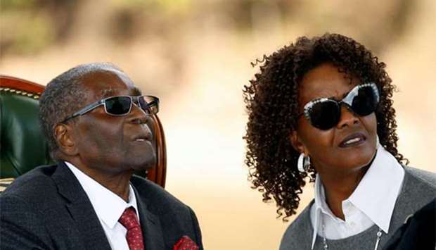 Zimbabwe's former president Robert Mugabe and his wife Grace look on after addressing a news conference at his private residence nicknamed ,Blue Roof, in Harare on Sunday.