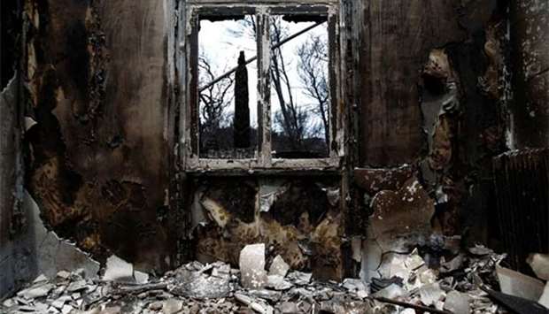 The interior of a burnt house is seen following a wildfire in Mati, near Athens.