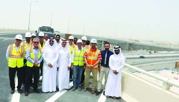 Officials of Ashghal and contracting companies on the newly commissioned section of the Bani Hajer interchange.
