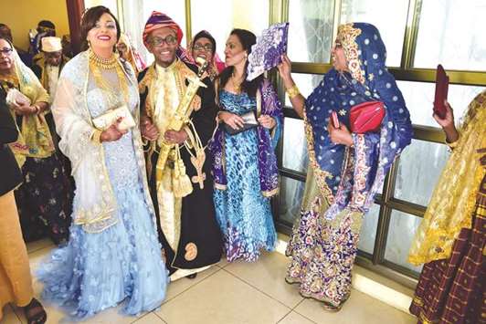 Guests sing for newly-weds during a traditional wedding ceremony at the home of the bride in Moroni.