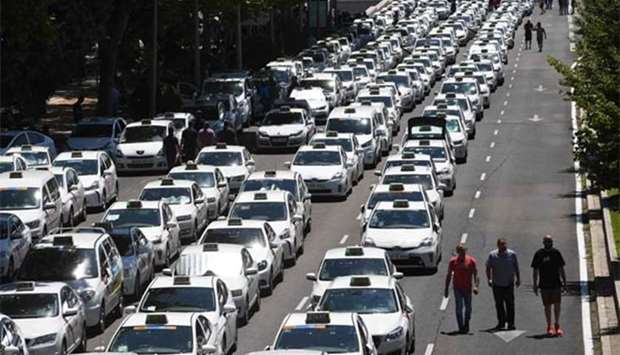 Taxi drivers block the Castellana Avenue amid a strike in Madrid on Monday.
