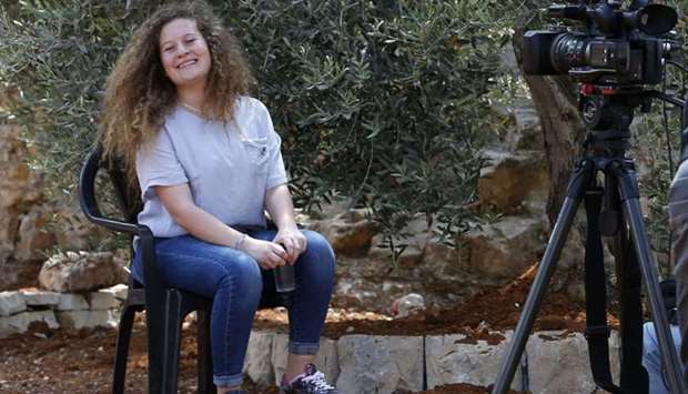 Ahed Tamimi smiles during an interview with AFP in the West Bank village of Nabi Saleh.