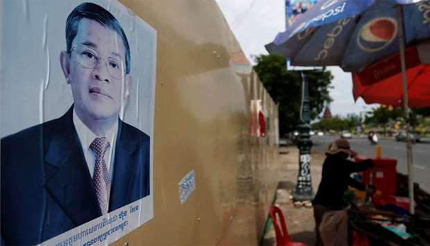 A poster of Cambodia's Prime Minister and Cambodian People's Party (CPP) President Hun Sen is seen along a street in Phnom Penh
