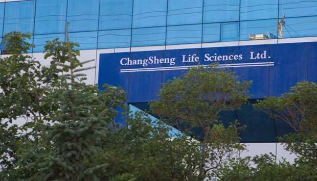 A sign of vaccine maker Changsheng Bio-technology Co Ltd is pictured at its building in Changchun