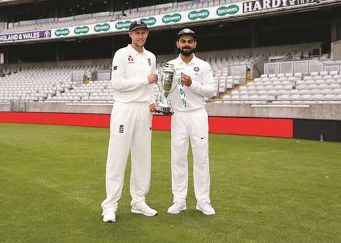 Englandu2019s Joe Root and Indiau2019s Virat Kohli pose with the trophy on the eve of the first Test at Edgbaston in Birmingham yesterday. (Reuters)
