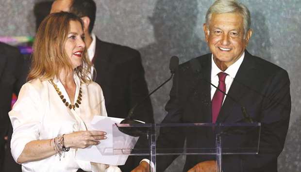 Mexicou2019s next President Andres Manuel Lopez Obrador addresses supporters next to his wife Beatriz Gutierrez Muller, in Mexico City, Mexico on July 1.