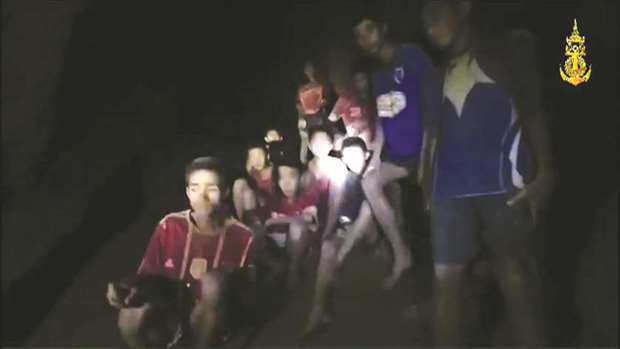 This handout video grab taken from footage released by The Royal Thai Navy, shows missing children inside the Tham Luang cave of Khun Nam Nang Non Forest Park in the Mae Sai district of Chiang Rai province.