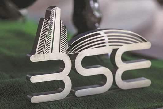 Signage for the Bombay Stock Exchange is displayed at the entrance to the BSE building in Mumbai. The Sensex closed up 0.8% to 35,645.40 points yesterday.