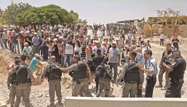 Demonstrators protest against Israeli demolitions in the Palestinian village of Khan al-Ahmar, east of Jerusalem in the occupied West Bank, yesterday.