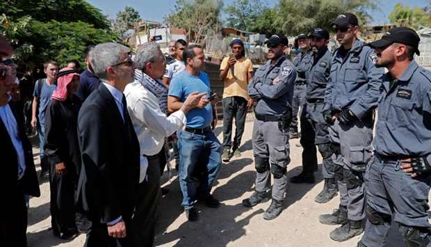 European General Consuls of France (L), Sweden, Belgium, Italy, Ireland, Switzerland, Findand, Denmark and European Union are blocked by Israeli police as they want to visit the Palestinian Bedouin village of Khan al-Ahmar, east of Jerusalem in the occupied West Bank.