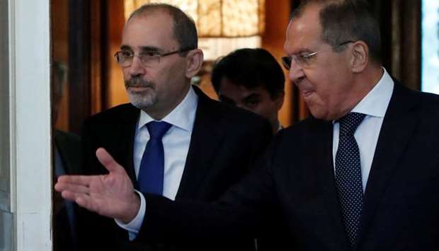 Russian Foreign Minister Sergei Lavrov and Jordanian Foreign Minister Ayman Safadi enter a hall during a meeting yesterday in Moscow.