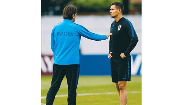 Croatiau2019s Dejan Lovren (right) speaks with coach Zlatko Dalic during a training session in Sochi, Russia, yesterday. (AFP)