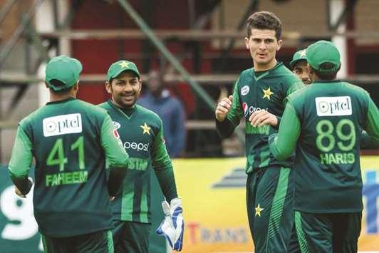 Pakistan bowler Shaheen Afridi (second right) celebrates with teammates after taking an Australian wicket during the T20 tri-series match at the Harare Sports Club in Harare, yesterday. (AFP)