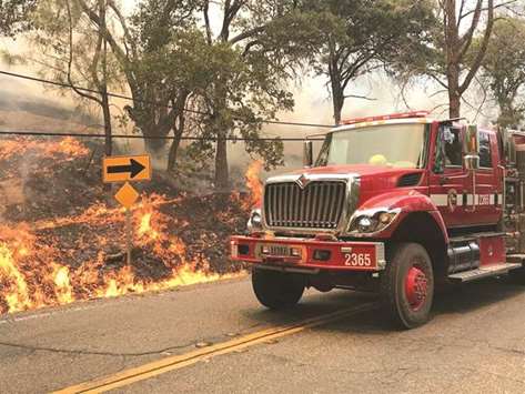 Flames from the County Fire, covering Yolo and Napa counties, east of Lake Berryessa, California, are pictured in this July 3 handout photo.