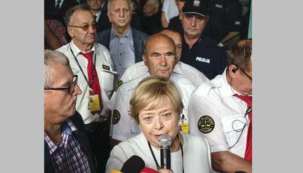 Gersdorf surrounded by members of the media and supporters when she arrived for work on Wednesday at the Supreme Court building in Warsaw.