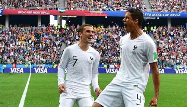 France's Raphael Varane celebrates with Antoine Griezmann after scoring the opener during the Russia 2018 World Cup quarter-final against Uruguay at the Nizhny Novgorod Stadium on Friday.
