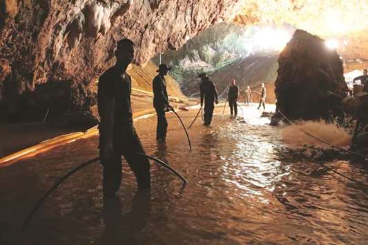 Thai Navy soldiers in the flooded Tham Luang cave during rescue operations for the 12 boys and their football team coach trapped in the cave at Khun Nam Nang Non Forest Park in the Mae Sai district of Chiang Rai province.