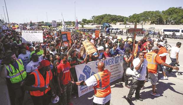 Activists march onto Chicago Dan Ryan Expressway to protest violence in the city in Chicago yesterday.