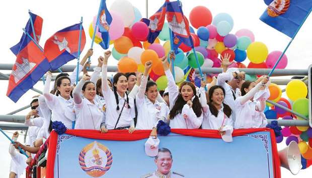 Supporters of Cambodian Peopleu2019s Party (CPP) parade in an open truck during the first day of campaign in Phnom Penh for the general election, yesterday.