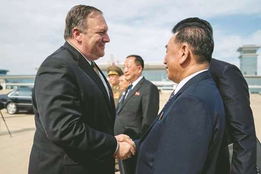 US Secretary of State Mike Pompeo says goodbye to Kim Yong-chol (right), North Korean senior ruling party official and former intelligence chief, before boarding his plane at Sunan International Airport in Pyongyang, yesterday.