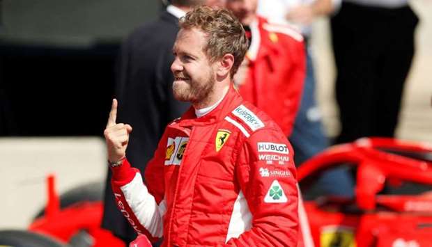 Ferrari's Sebastian Vettel celebrates after winning the British Grand Prix