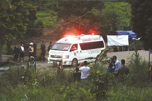 An ambulance leaves the Tham Luang cave area after divers evacuated some of the 12 boys and their coach trapped at the cave in Khun Nam Nang Non Forest Park in the Mae Sai district of Chiang Rai province yesterday.