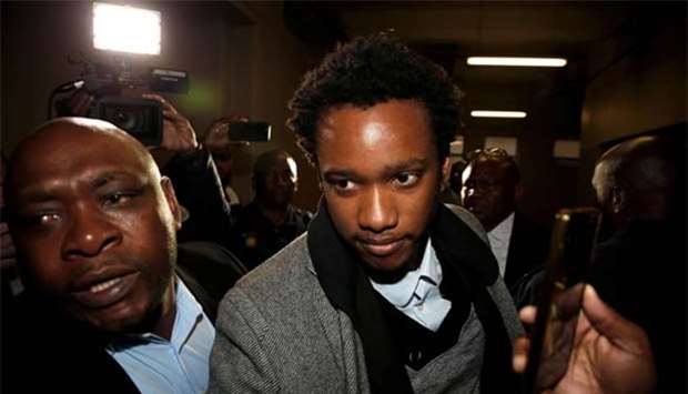 Duduzane Zuma, the son of scandal-plagued former South African president Jacob Zuma, arrives at Johannesburg's Specialised Commercial Crime court on charges of corruption, in Johannesburg on Monday.