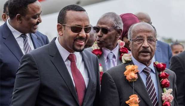 Eritreau2019s Foreign Minister Osman Saleh Mohammed (right) walks with Ethiopiau2019s Prime Minister Abiy Ahmed and Ethiopia's Foreign Minister Workeneh Gebeyehu (left) in Addis Ababa last month.