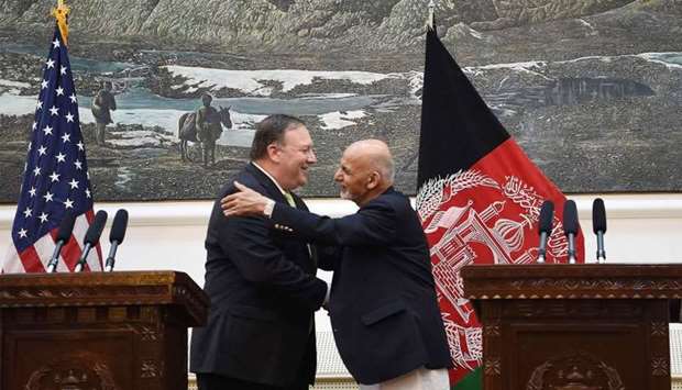 US Secretary of State Mike Pompeo (L) shakes hands with Afghan President Ashraf Ghani (R) after a press conference at the Presidential Palace in Kabul