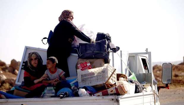 A Syrian family returns to their homes in towns and villages situated on the eastern outskirts of Daraa
