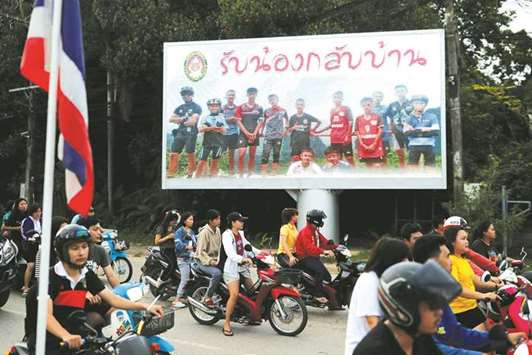 A board showing u201cWelcome home, boysu201d, is seen in Chiang Rai yesterday.