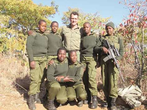 ALL WOMEN TEAM: Damien Mande, head of the International Anti-Poaching Foundation, poses with some of the all-female team of anti-poaching rangers at Phundundu wildlife area in the lower Zambezi region.