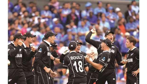 New Zealand players celebrate after Indiau2019s Mahendra Singh Dhoni (not pictured) was run out during the 2019 ICC Cricket World Cup semi-final at Old Trafford in Manchester, United Kingdom, yesterday. (AFP)