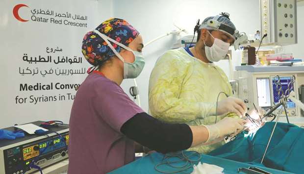 Qatar Red Crescent Society team performing a surgery.