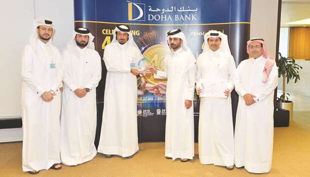 Sheikh Mohamed Fahad bin Mohamed bin Jabor al-Thani presenting the donation cheque to Dreama representatives.